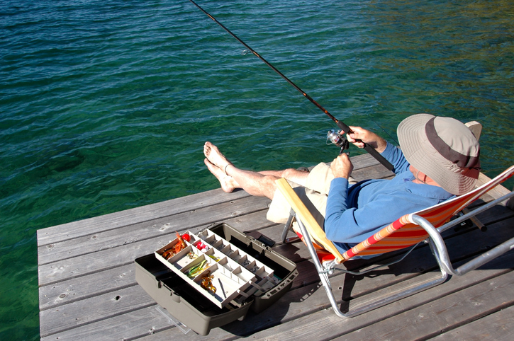 Person fishing off the cottage dock